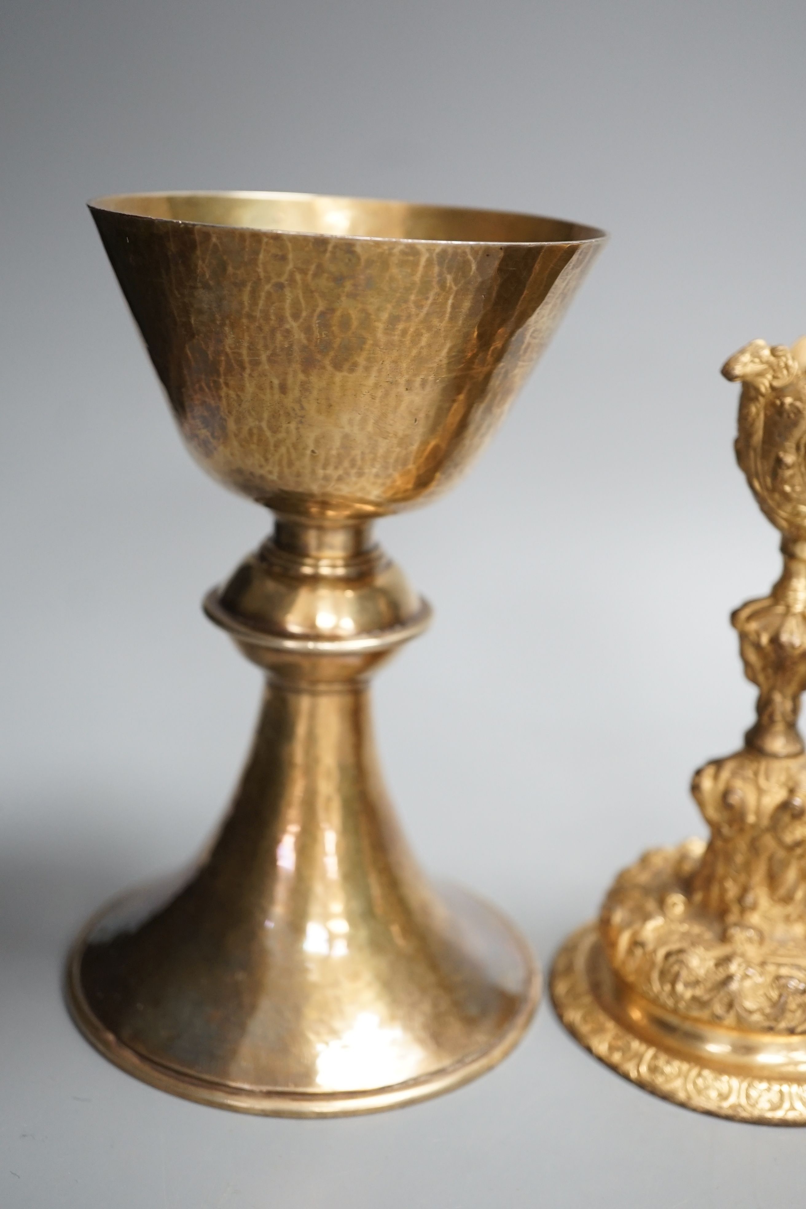 A decorative ormolu inkwell, 20cm high, a Baroque style candlestick, a chalice stamped W IV, together with a faux tortoiseshell pot (4)